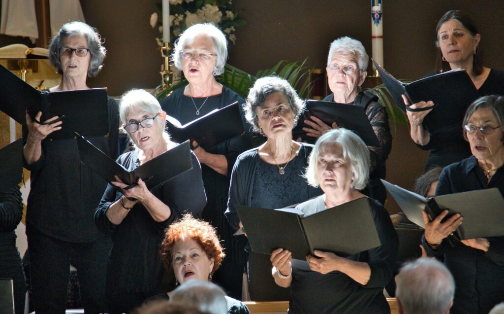Members of Meridian Women&rsquo;s Chorus singing together at a Thursday rehearsal.